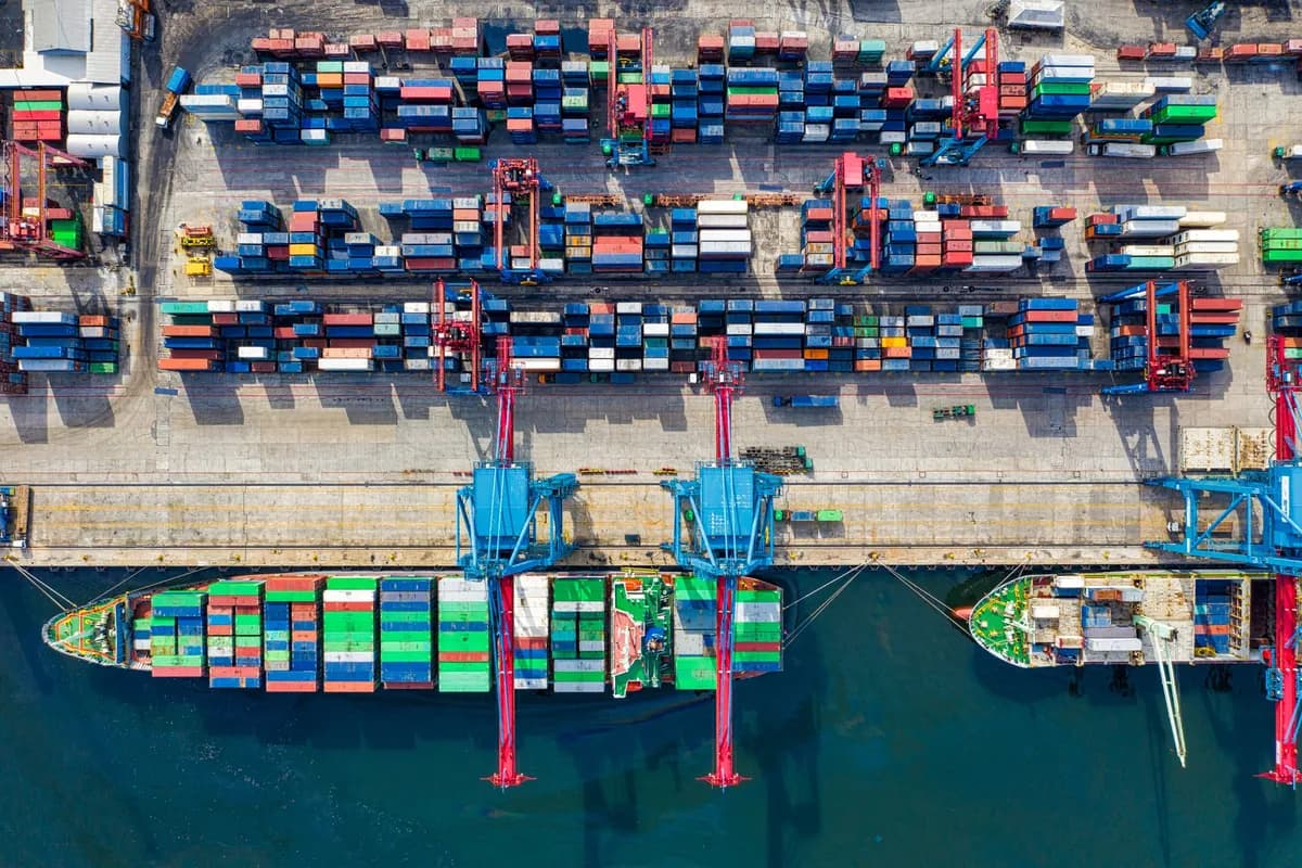 Aerial view of shipping containers arranged in a geometric grid